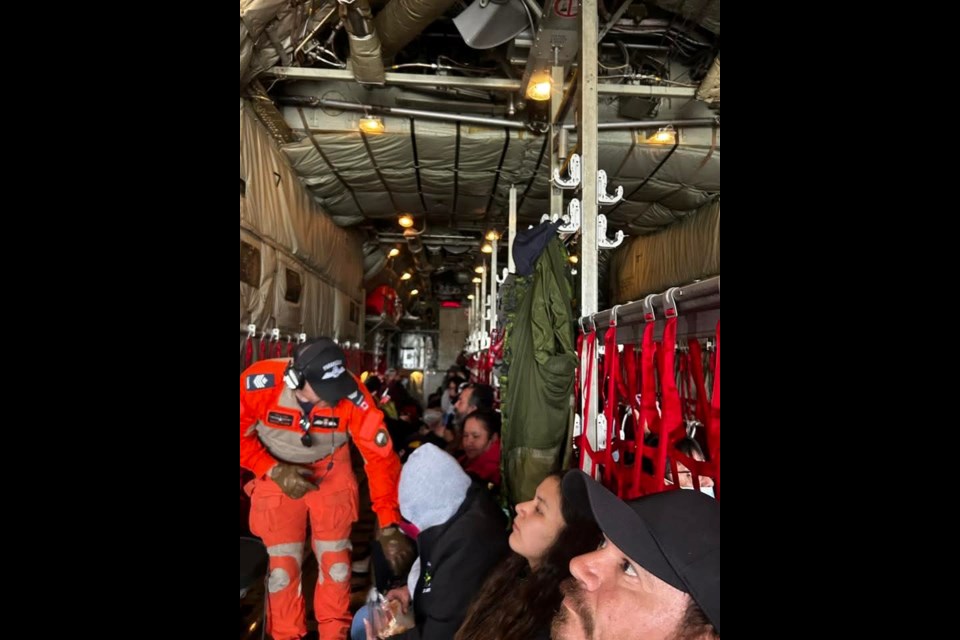 Evacuees leave Sandy Lake First Nation on a Hercules aircraft, June 9 2025. (Submitted/Gail Anishinabie)