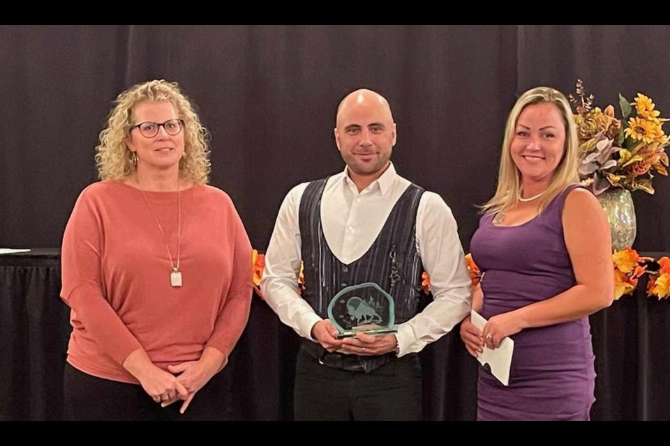 Benjamin Feagin Jr. (middle) was a multiple award winner at the Dryden District Chamber of Commerce Business Excellence Awards held on Sat. Sept 24. He's joined by Pauline Douglas, Chair of the Chamber (left) and Brooke Baxter of Treasury Metals (right) (photo facebook.com/drydendistrictchamber)
