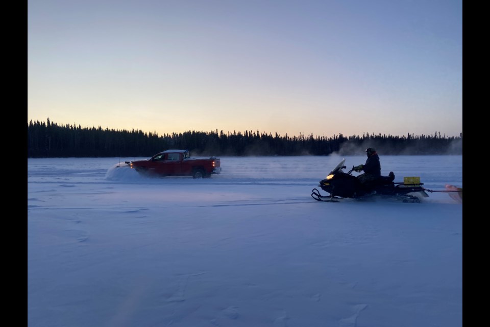 Preparing ice roads on the Severn River near Muskrat Dam First Nation. (courtesy Roy Fiddler)