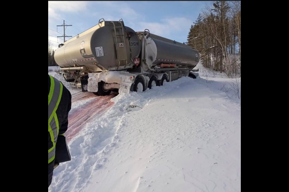 A jackknifed trailer believed to be carrying diesel fuel has closed a stretch of Highway 599, along with weather conditions, since Dec. 24. (Nora Kanate, Facebook)