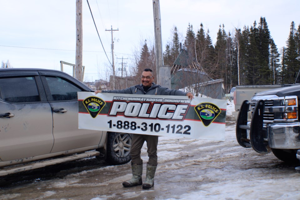 K.I. police officer Barry McKay holds a memento from the KI Police. (Clint Fleury, NWOnewswatch.com) 