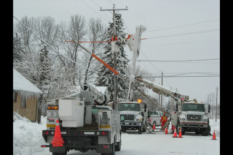 Fort Frances Power Corporation workers installing equipment. (Fort Frances Power Construction)