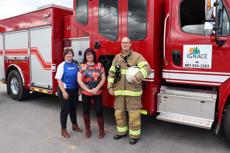 : Joanne Jacyk, Site Director, NWMO; Kim Baigrie, Ignace Interim Mayor; and Sean DeTracey, Ignace Fire Chief, were delighted to accept delivery of Ignace’s new fire truck. (Photo by NWMO)