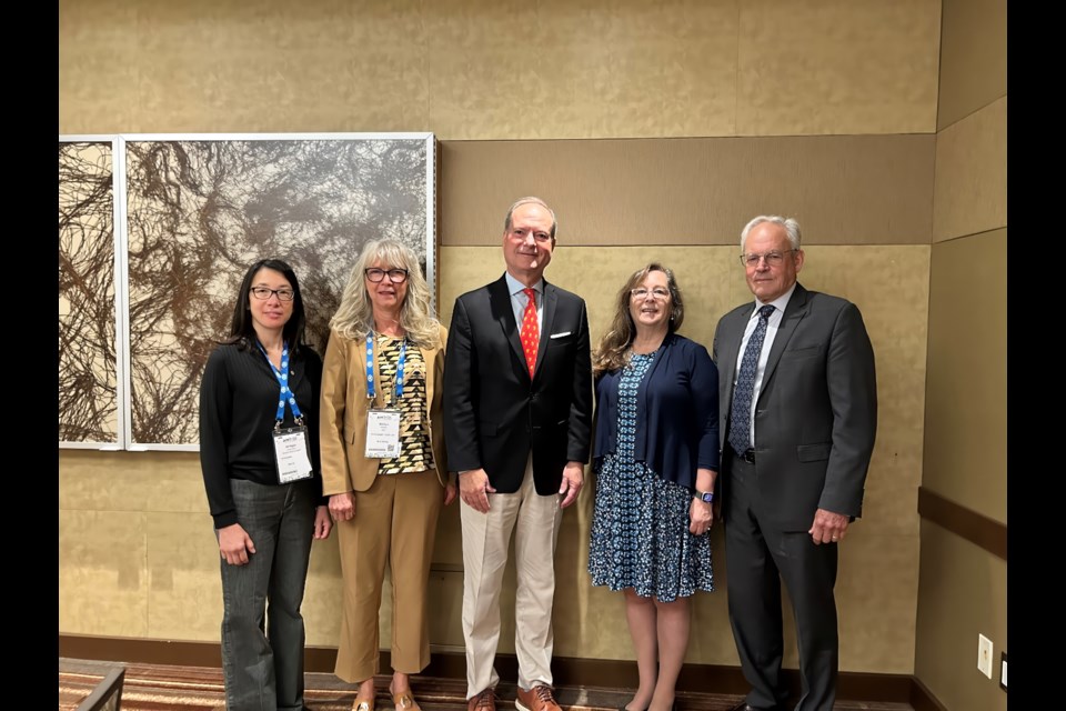 Ontario Finance Minister Peter Bethlenfalvy, centre, poses for a photo with the Northwestern Health Unit's Dr. Kit Young Hoon, Marilyn Herbacz, Trudy Sachowski and Doug Lawrance during the 2024 AMO conference in Ottawa.