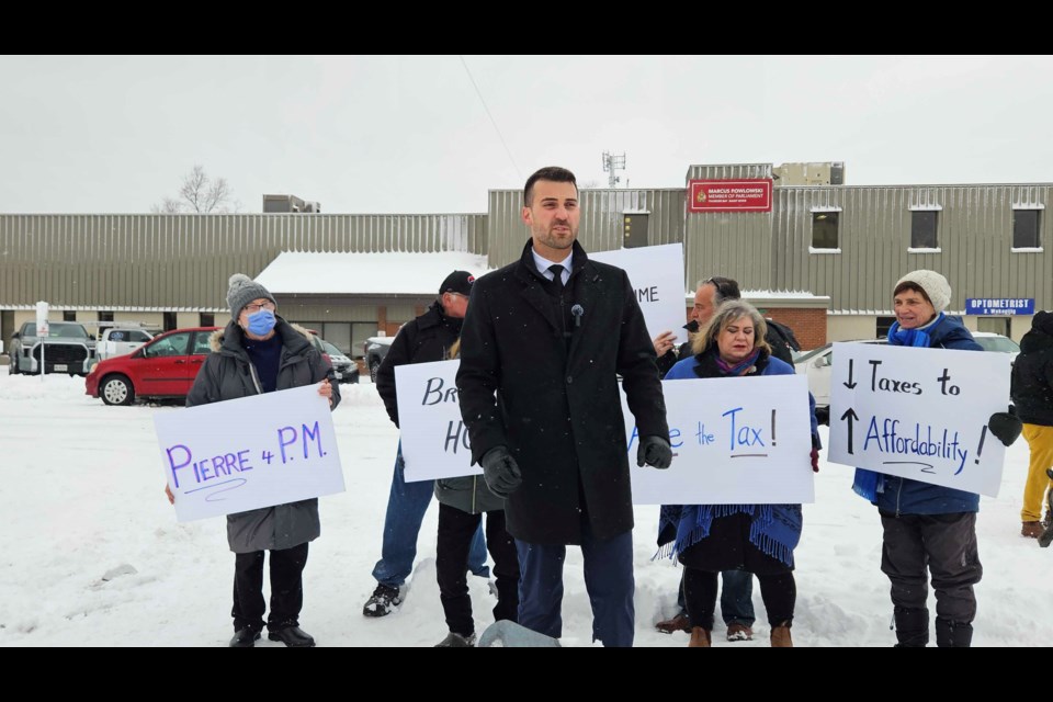 Conservative MP Eric Melillo held a protest outside of Liberal Member of MP Marcus Powlowski's constituency office on Monday to call on Powlowski to vote with the Conservatives to “Spike the Hike (Katie Nicholls/TBnewswatch)