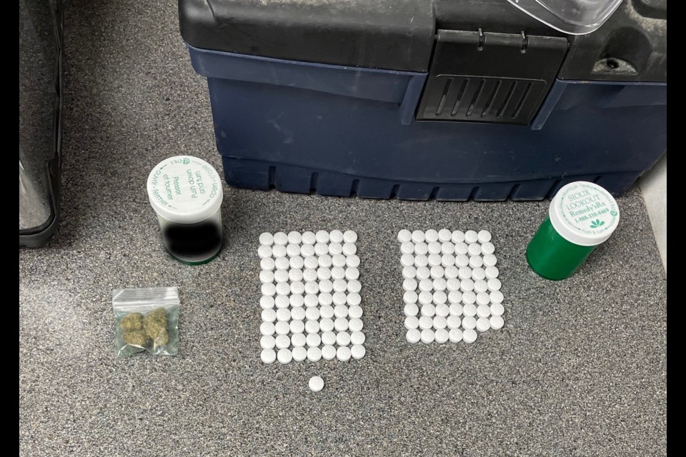 Police located and seized a quantity of suspected cocaine, oxycodone pills, and cash.(Photos submitted by NAPS)