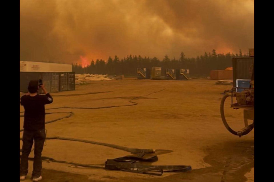 A construction crew sought safety from a forest fire in shipping containers Saturday near Sandy Lake First Nation