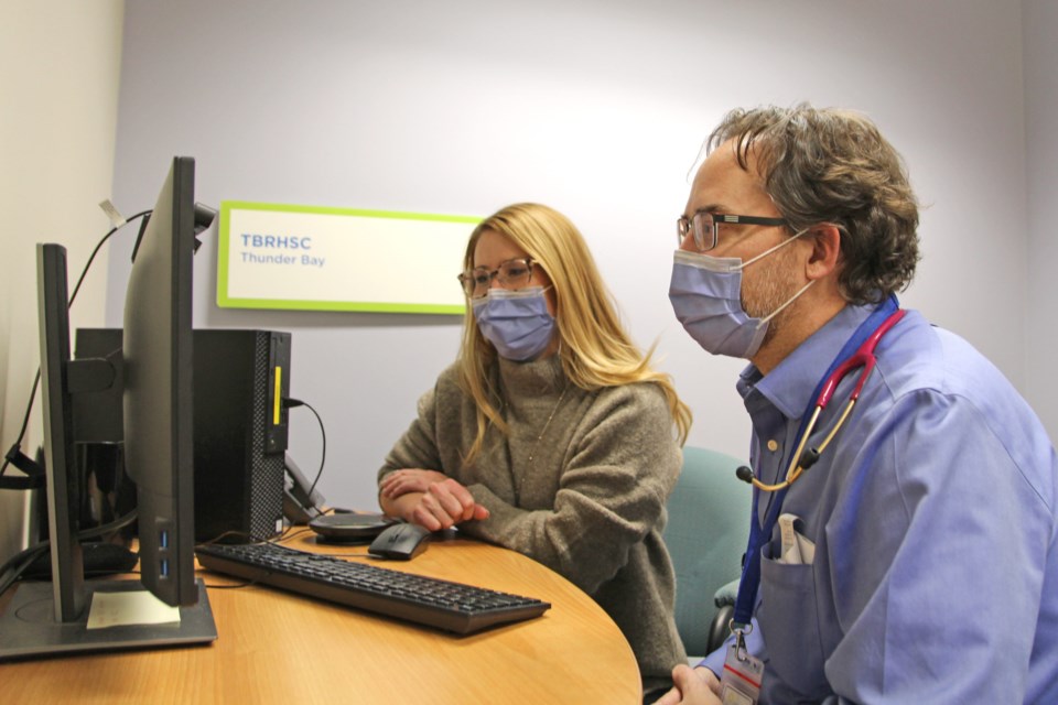 Photo info (L-R): Meghan Hill, Regional Paediatric Lead and Dr. Justin Jagger, Paediatrician, demonstrate the new Virtual Paediatric ER Consultation Program at Thunder Bay Regional Health Sciences Centre. (Courtesy Thunder Bay Regional Health Sciences Centre)