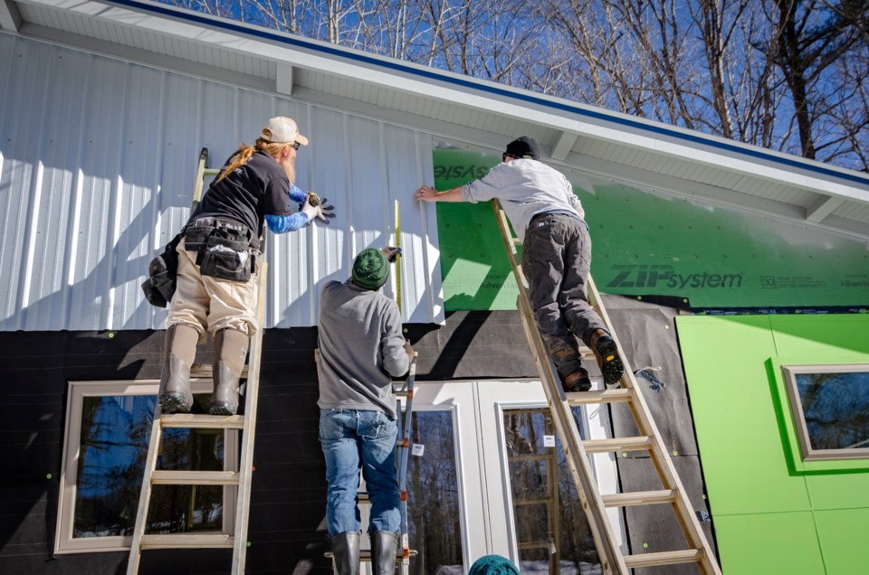 Construction workers on house