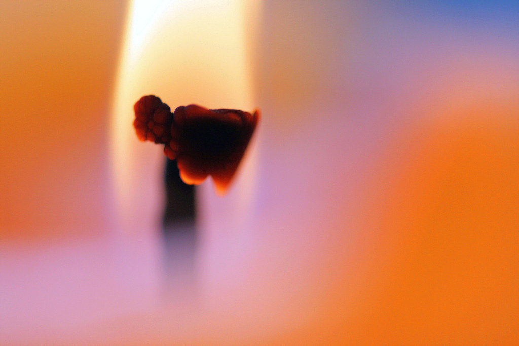 Close up of a lit candle wick | Photo credit: Pixel Addict  -  Foter  -  CC BY