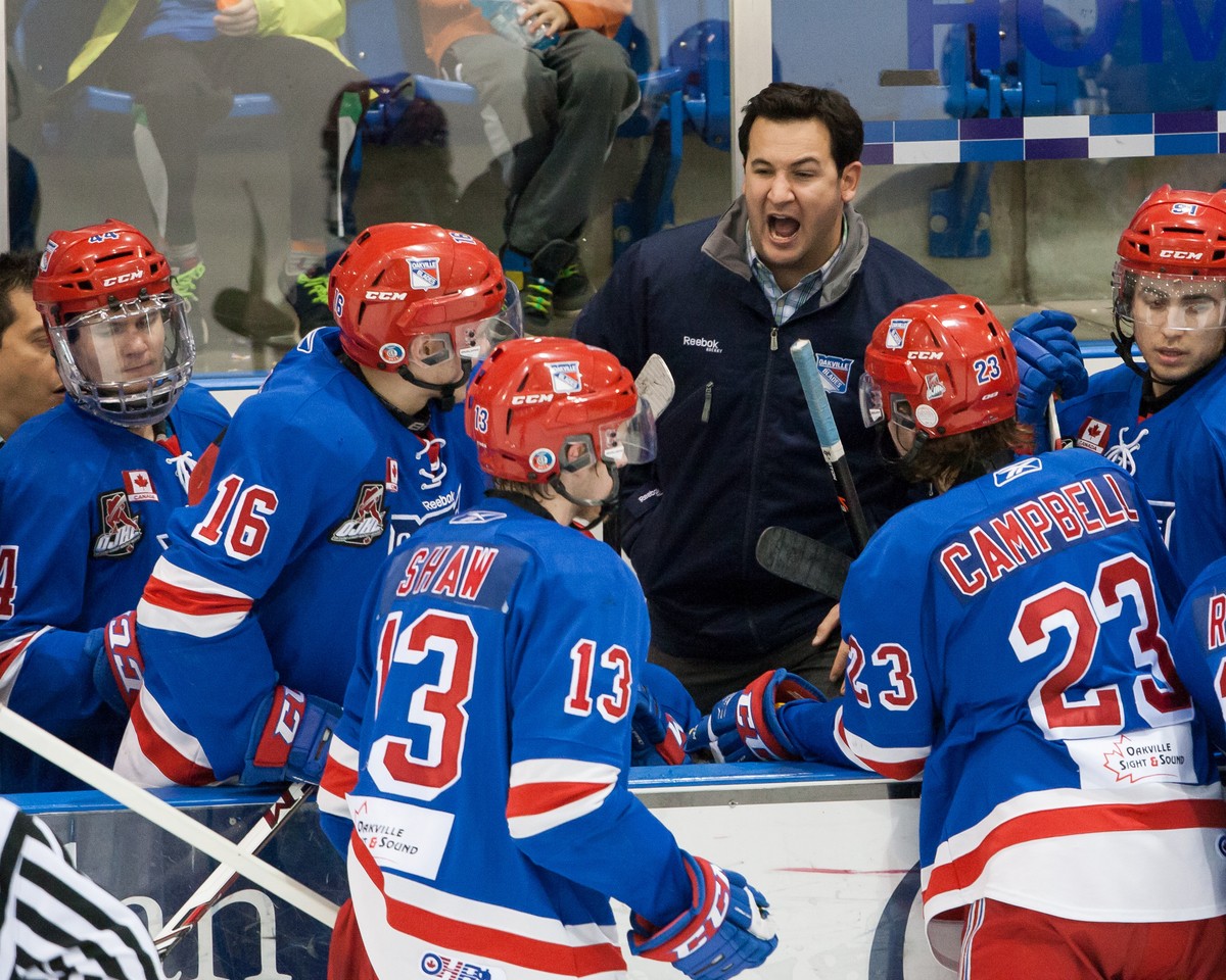 Oakville coach Mike Tarantino gives his team instructions during a time out. | Kevin Sousa  -  OJHL Images