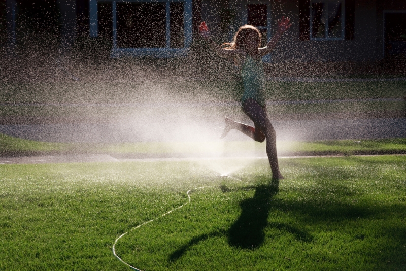 child playing in a sprinkler | gfpeck  -  Foter  -  CC BY-ND 2.0