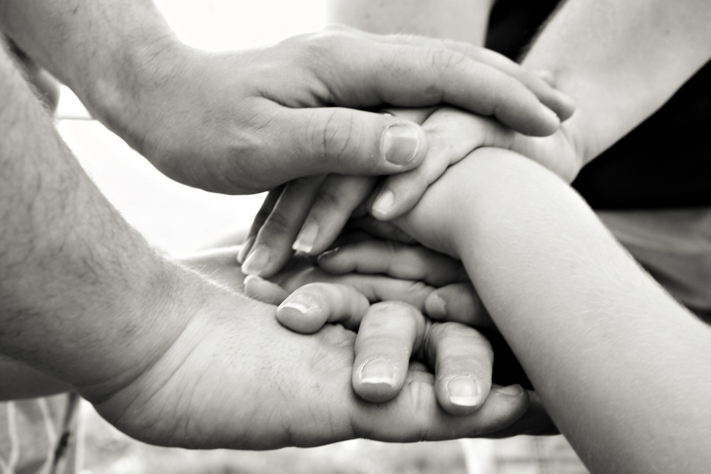 Family set of hands stacked | Photo credit: RebeccaVC1  -  Source  -  CC BY-ND