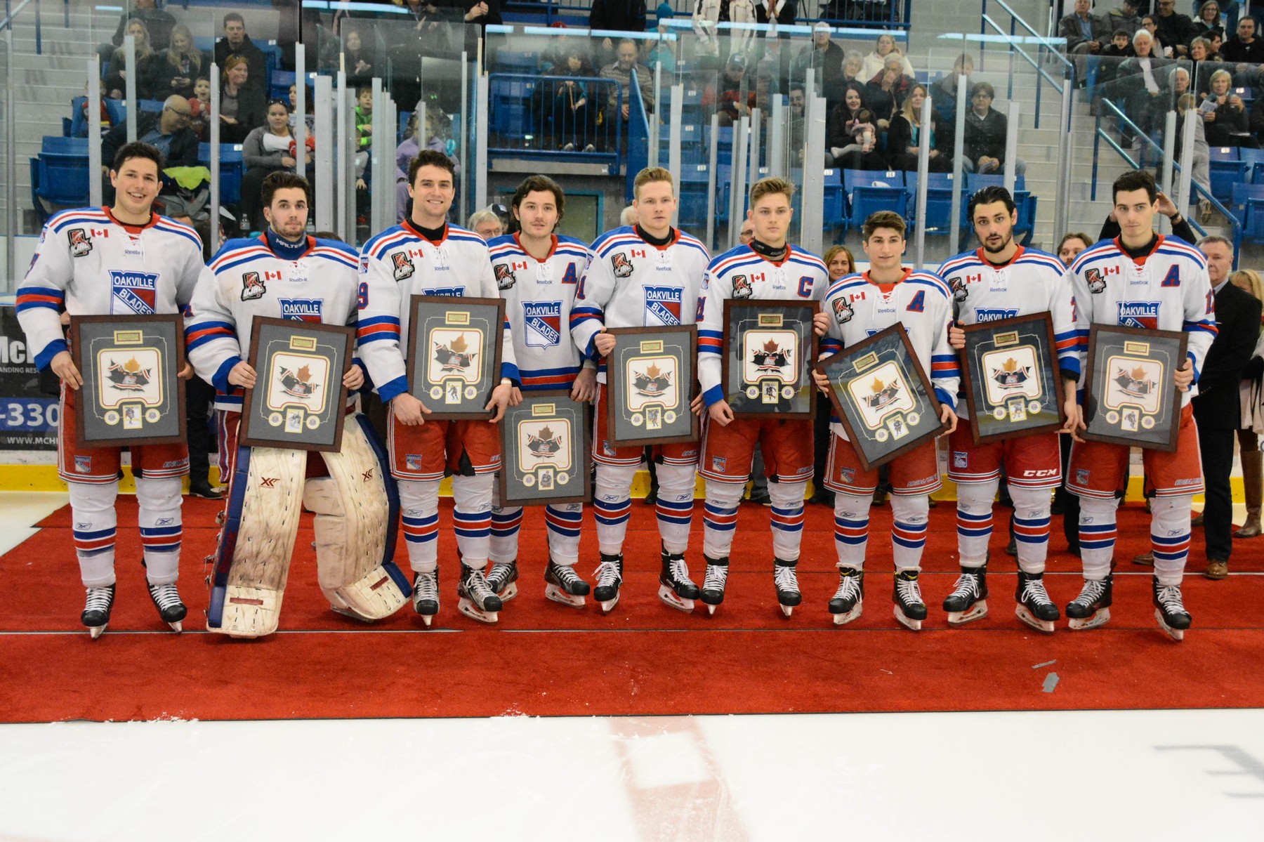 Graduating members of the Oakville Blades pose following a pre-game ceremony on Monday, February 20th. | Steven Ellis - Oakville Blades