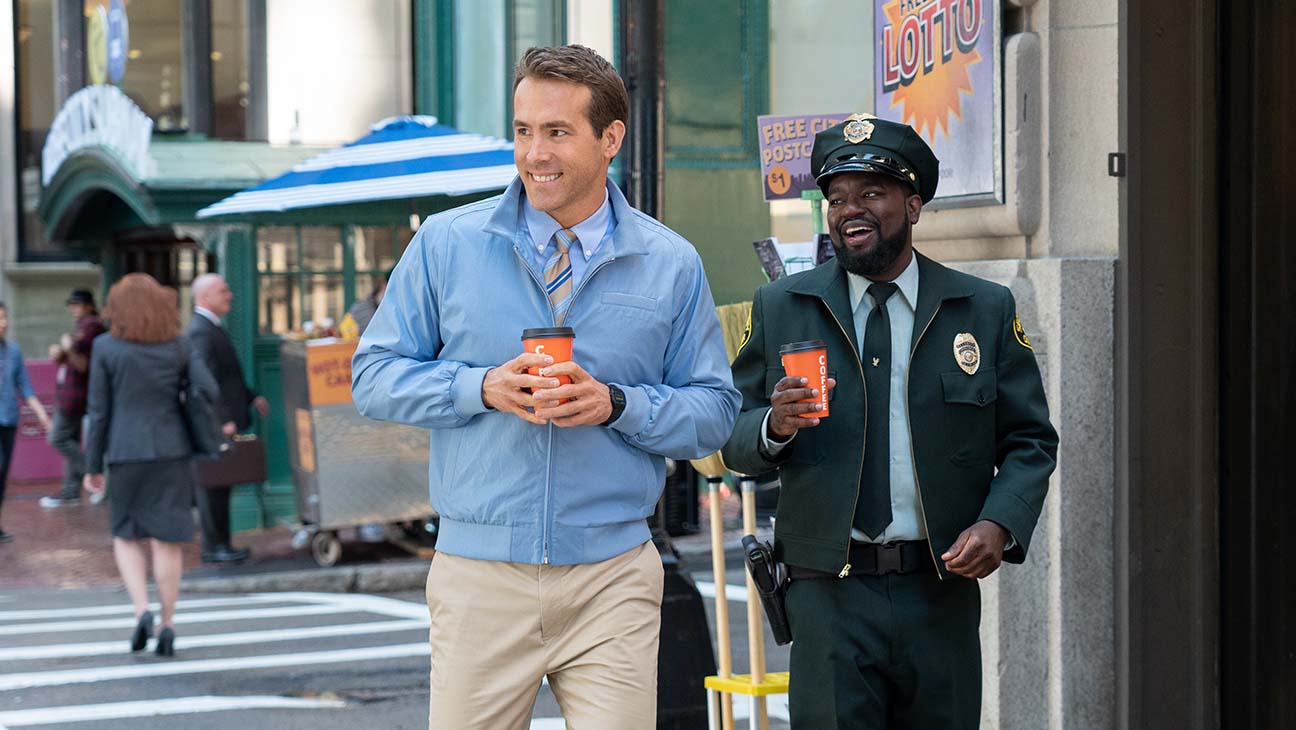 Ryan Reynolds as Guy and Lil Rel Howery as Buddy in 20th Century Studios’ FREE GUY. | 20th Century Studios