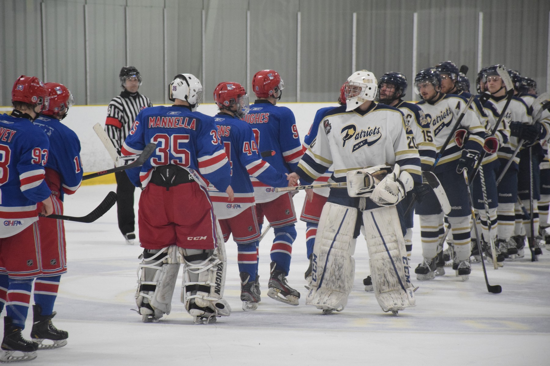Toronto Patriots shake hands at the end of the game against the Oakville Blades | Scott Ellis - The Hockey House