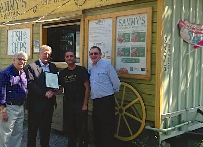 Ralph Robinson, Mayor Rob Burton, Sammy, Alan Johnston, Certificate of Recognition | Robinson in a photo-op with Mayor Burton and town locals