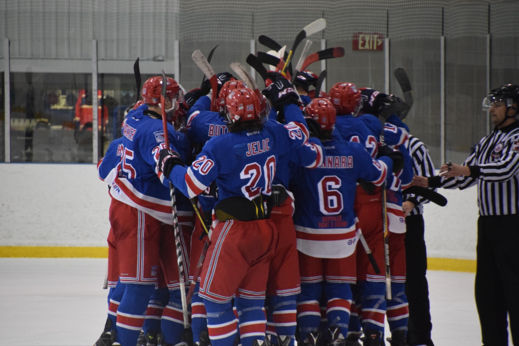Oakville Blades celebrating on the ice | Scott Ellis - The Hockey House