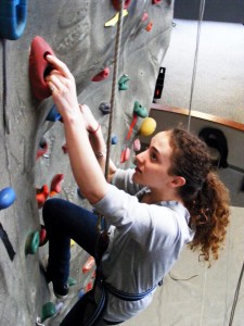 Young woman indoor rock climbing |  Try something new like rock climbing; Photo Credit: Jose Kevo