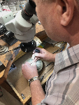 Certified Master Jeweller Anatolii Zharko takes special care in cutting a stone for a custom piece at Oakville Jewellery | Michele Bogle