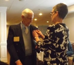 Bill Barnes receives Paul Harris Award |  Past President Karen Milner presenting Bill with a Paul Harris Award. Image Credit: Rotary Club of Oakville Trafalgar