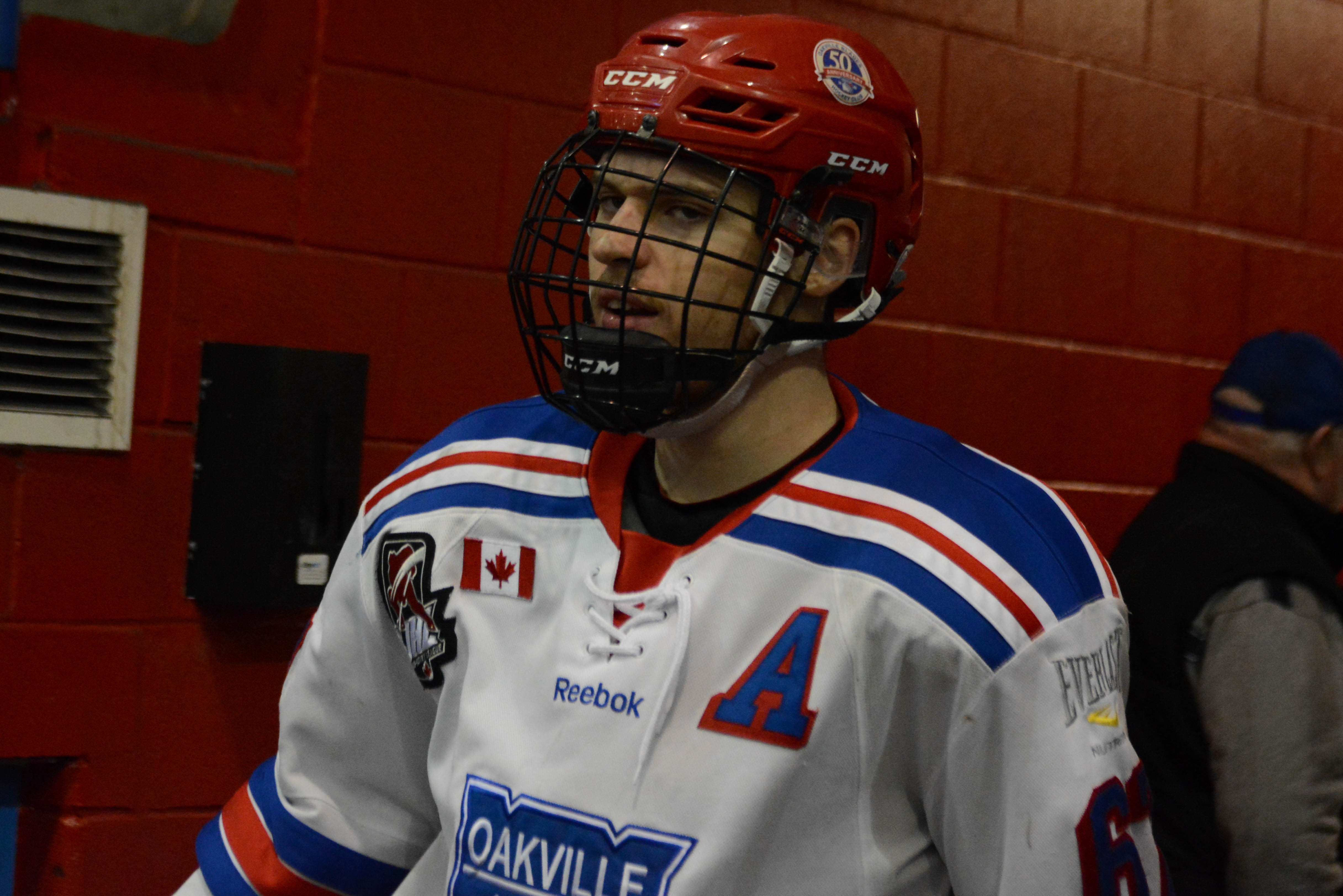 Drew Worrad gets ready to skate on the ice for warmup before Oakville