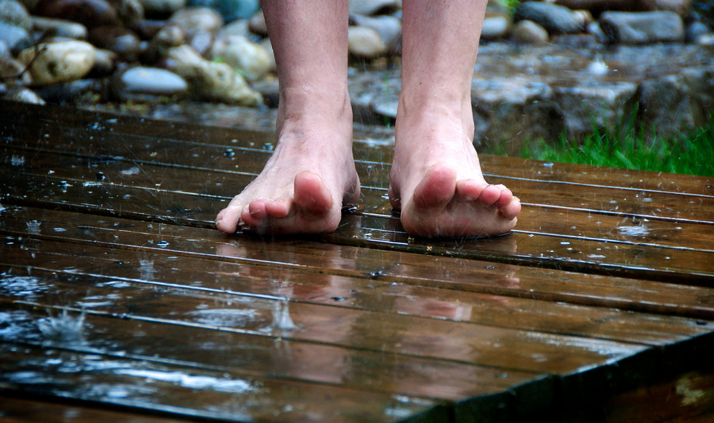 Feet on wooden deck that is wet | bark  -  Foter  -  Creative Commons Attribution 2.0 Generic (CC BY 2.0)