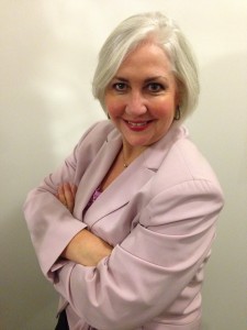 Head and torso of woman with short hair wearing a blazer |  Suzanne Longstreet, Business Clarity Coach will be a speaker at the event