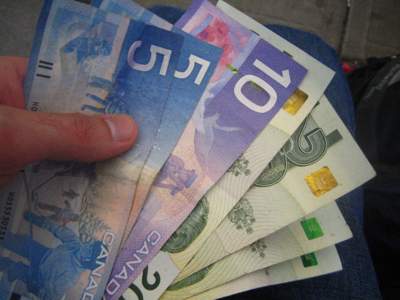 10-year Capital Forecast hand holding Canadian Currency: $5, $10,  &  $20 Bills | rick  -  Foter  -  CC BY 2.0