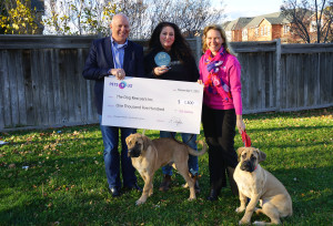 Three people 2 dogs with presentation cheque | The Dog Rescuers Inc. also won a National Award for their great work. | Oakville News