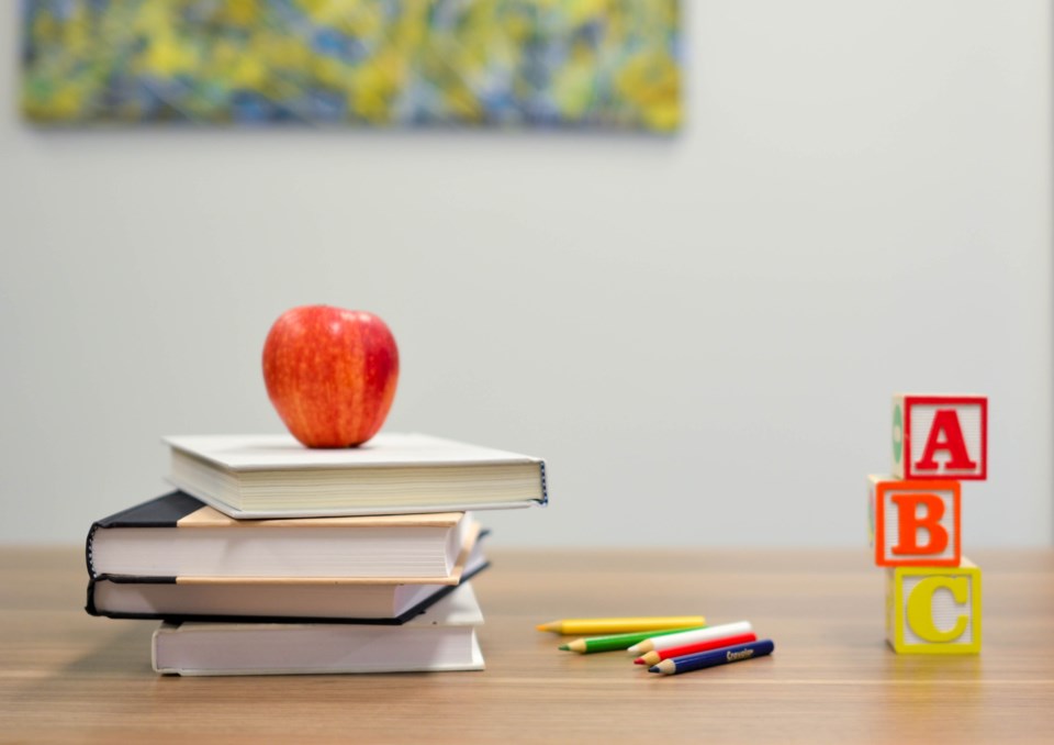teacher-apple-education-wooden-blocks-coloured-pencils
