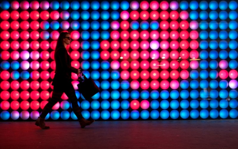 lady with briefcase in front of light display | Thomas Leuthard via Foter.com  -  CC BY