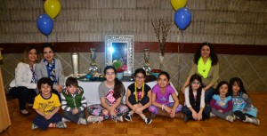 Children sitting in front of a table | The Ceremonial Alter; the Haftsin Centre of the Nowruz New Year