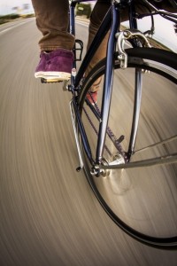 Close up of front wheel of a bicycle moving | Carsten Schertzer / Foter / CC BY