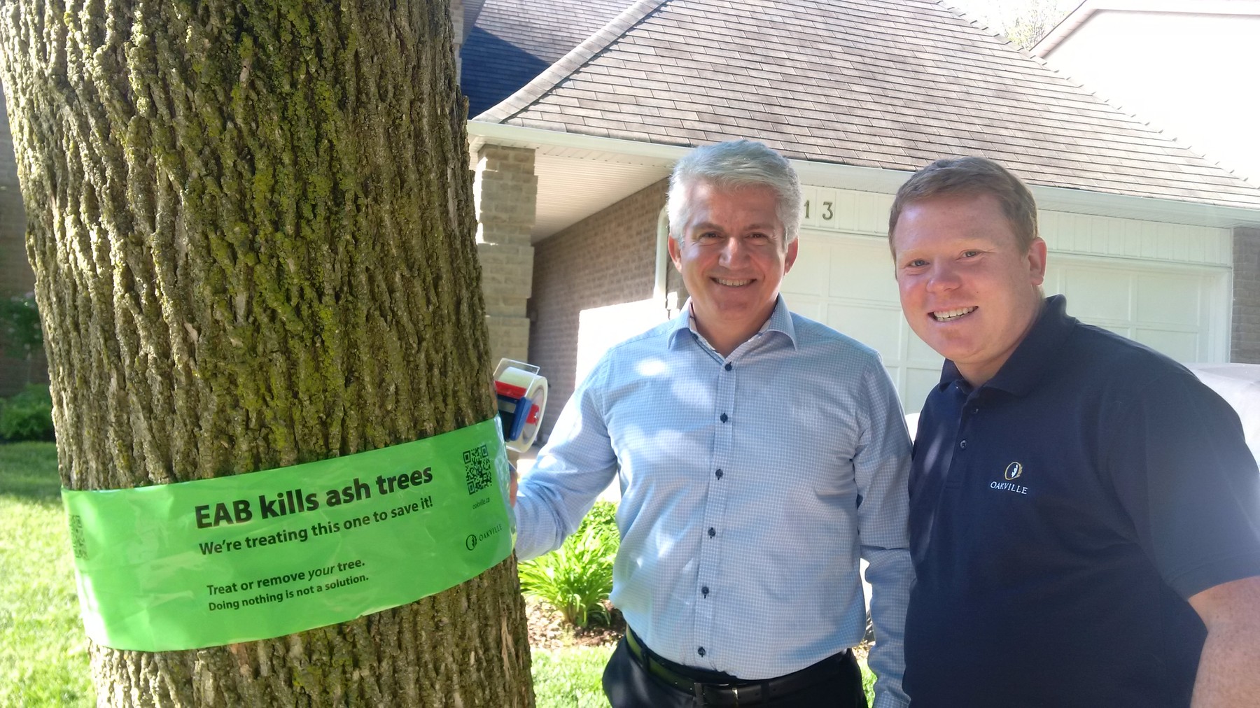 Jalil Hashemi (left), acting manager, Town of Oakville Forestry Services, and Regional and Town Councillor Sean O’Meara launch the town’s 2016 Canopy Conservation program to treat ash trees. | Town of Oakville