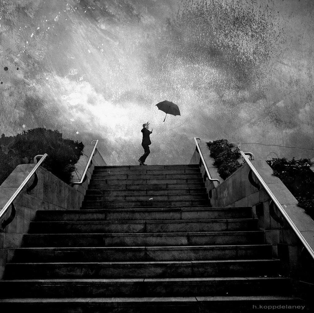 person at the top of a set of stairs in a storm loosing their umbrella in the wind | h.koppdelaney via Foter.com  -  CC BY-ND