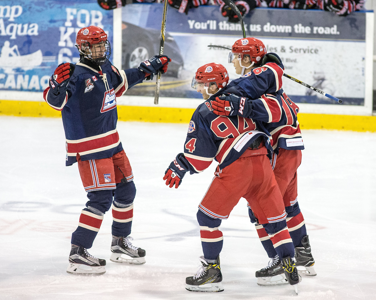 Bryce Misley #18 of the Oakville Blades celebrates with teammates | Kevin Sousa  -  OJHL Images