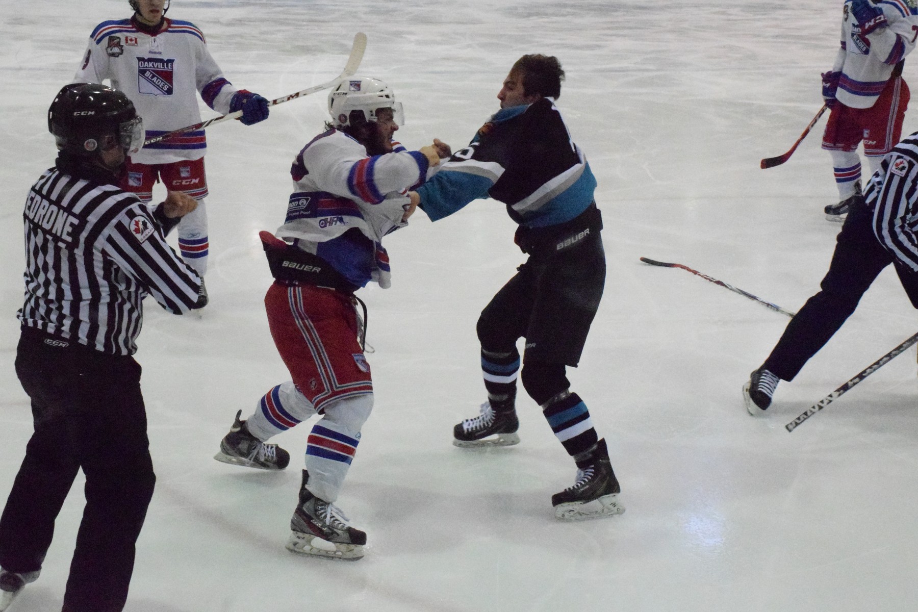 Vince Palermo goes at it with a Lindsay Muskies player late in the third period. | Scott Ellis - The Hockey House