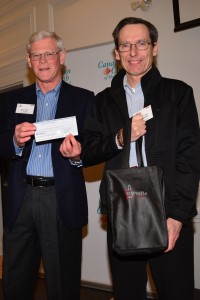 two men in suits holding a check |  A Donation to Stephen
