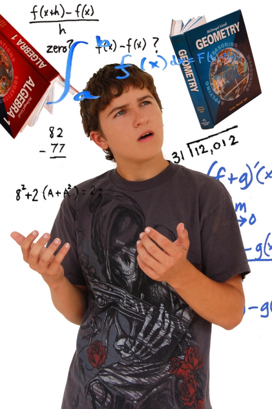 Highschool Student looking a math equations on glass wall | ddluong_  -  Foter  -  CC BY