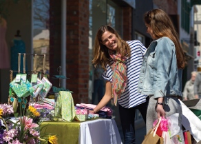 Ladies shopping at a sidewalk sale in Downtown Oakville | Downtown Oakville BIA