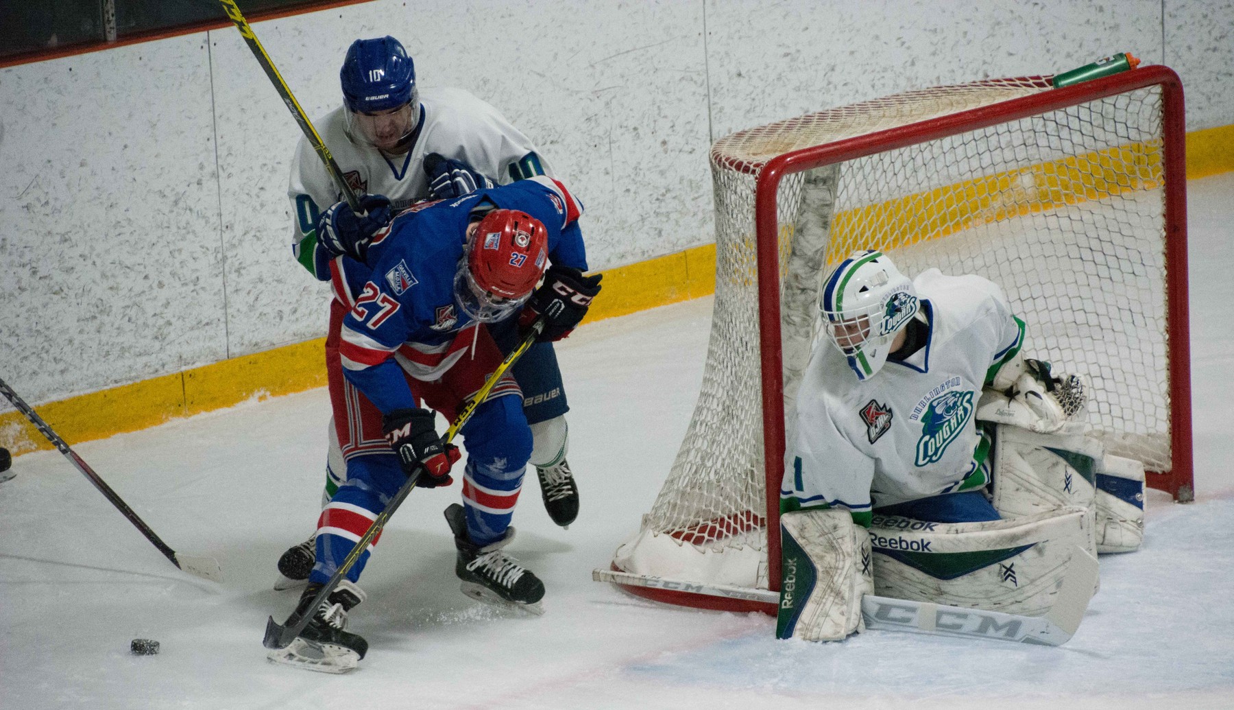 Three Hockey Players around the net | Steven Ellis - Oakville Blades