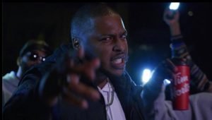 Akil McKenzie acting in his music video 