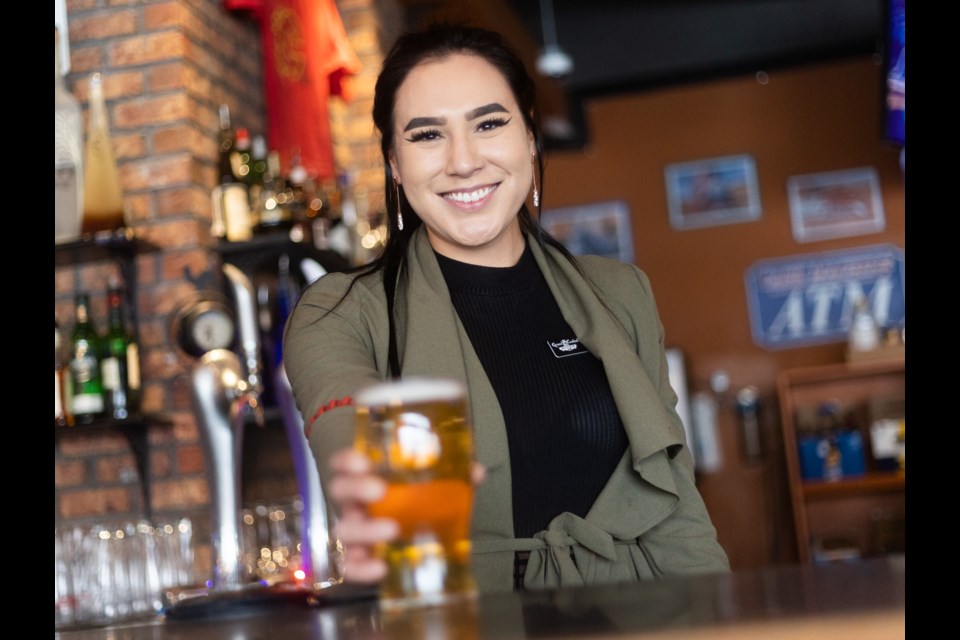 Virginia Saskatchewan is manager of Grand Central Bar and Grill, which is hosting game nights for the Battle of Alberta playoff series between the Calgary Flames and Edmonton Oilers.