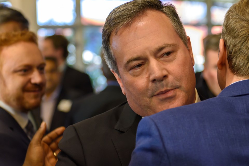 Alberta Premier Jason Kenney embraces supporters after announcing he will step down as Premier and leader of the United Conservative Party after leadership review results were announced at Spruce Meadows in Calgary on May 18. May 18, 2022.