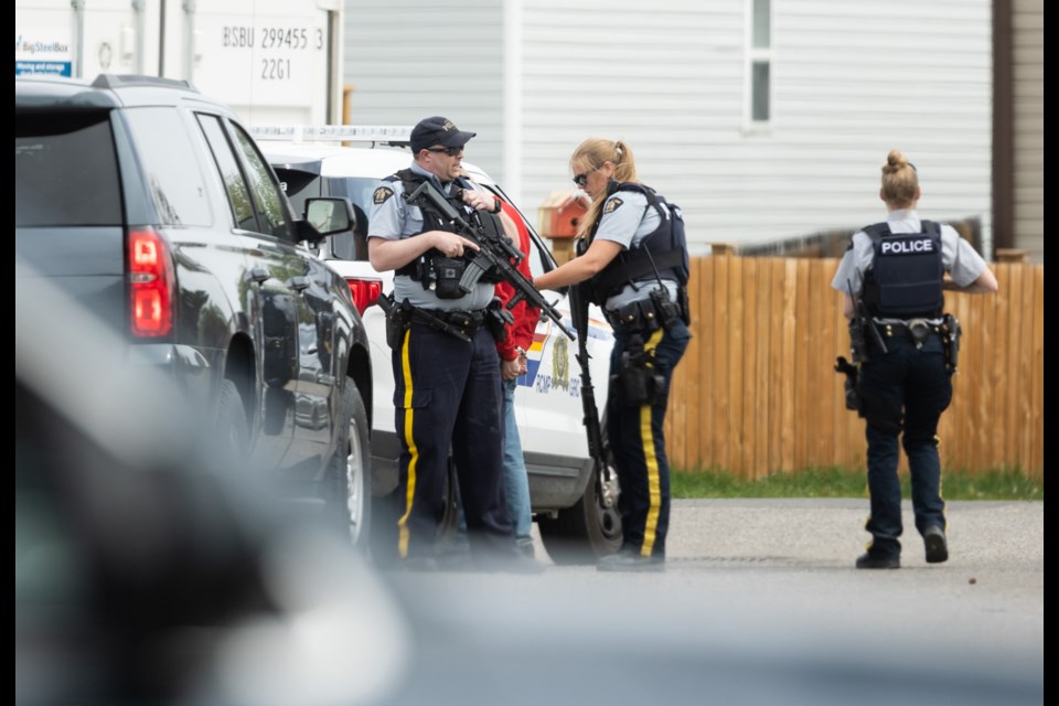 RCMP members take one man into custody near Heritage Drive in the Okotoks Village trailer park on June 3 following an incident where a man was allegedly injured with what turned out to be a pellet or BB gun.