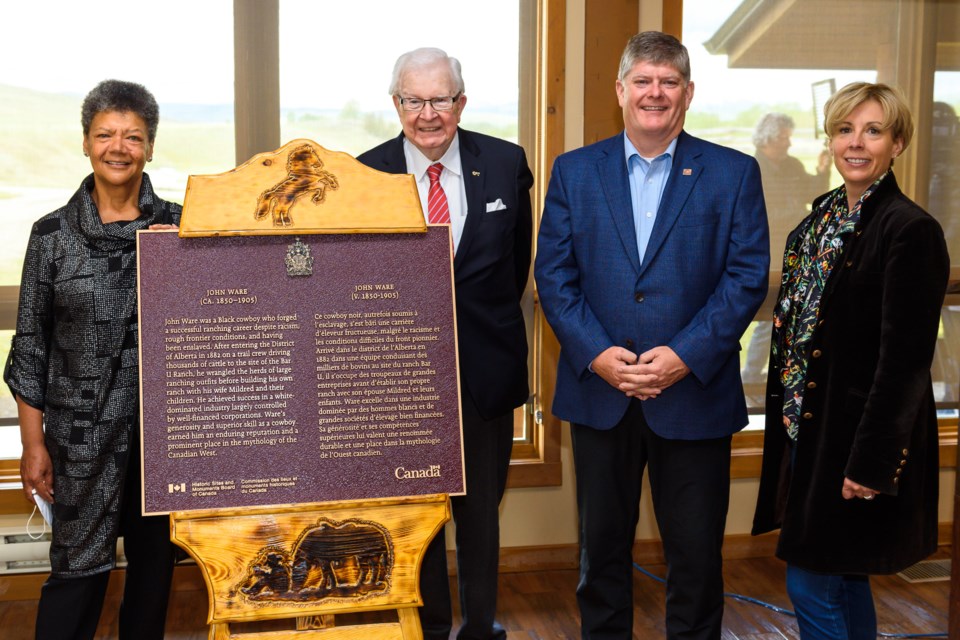 From left, Cheryl Foggo, Dr. Richard Alway, Ron Hallman, CEO Parks Canada Agency and Janet Annesley unveil a plaque dedicated to John Ware at the Bar U Ranch National Historic Site on June 6.