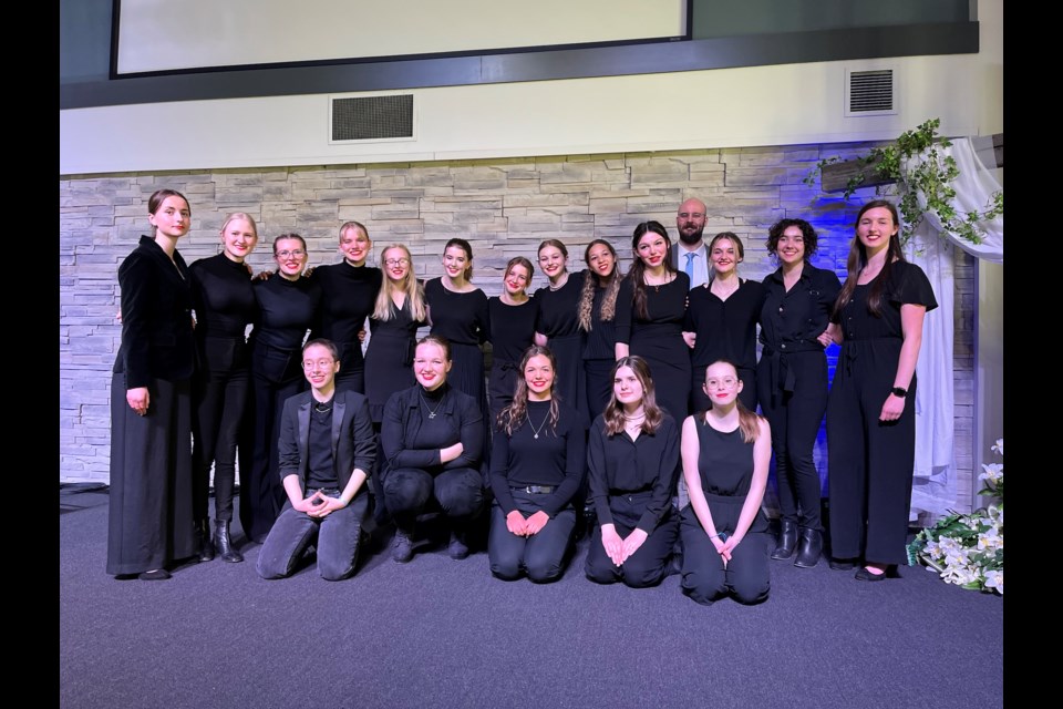 Student members of the Alberta High School of Fine Arts choral group, led by teacher Matt Ellis (back right). The group brought home gold from this year's provinicial competition. 