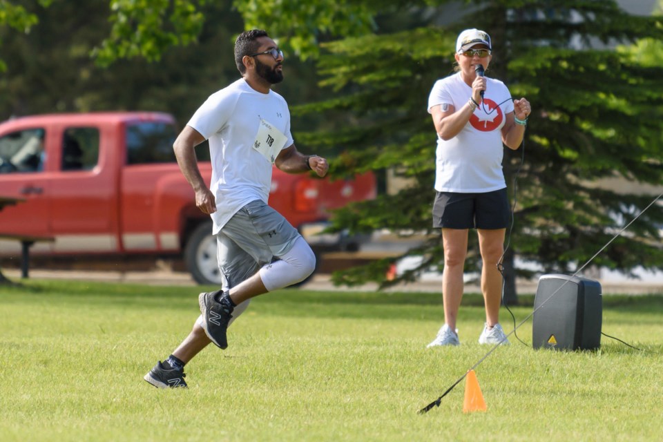 Sheikh Bahashwan nears the finish line during the first annual Diamond Valley Splash and Dash in Turner Valley on July 1, 2022. 