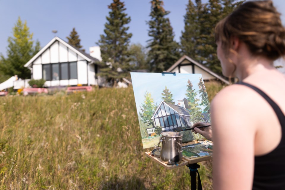 Mackenzie Clarke paints en plein air during 2022's Paint the Foothills event at the Leighton Art Centre.